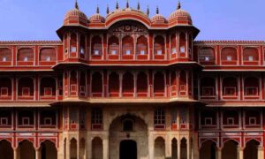 Iconic Laal Mahal in Pune, India, a red-bricked historic structure known for its connection to Chhatrapati Shivaji Maharaj, featuring traditional Maratha architecture and lush surroundings.