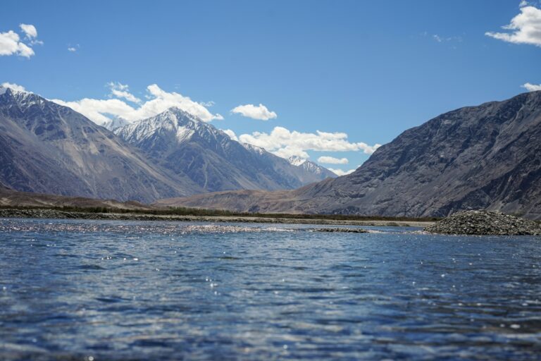 Yarab Tso Lake, a hidden gem in Nubra Valley, Ladakh, surrounded by rugged mountains and known for its pristine, crystal-clear waters. A peaceful, sacred spot accessible by trekking near Sumur Village